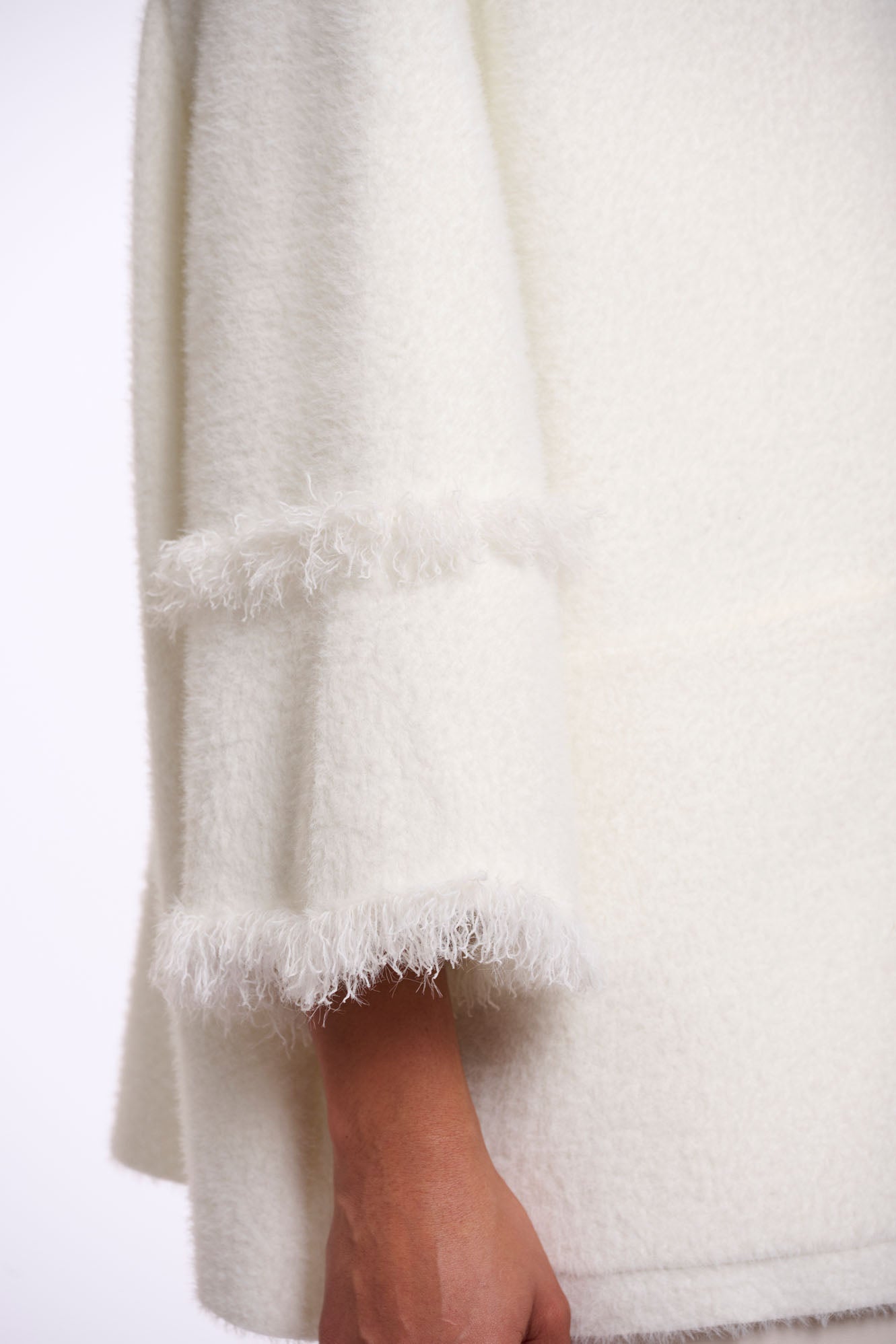 Cape with fringe details