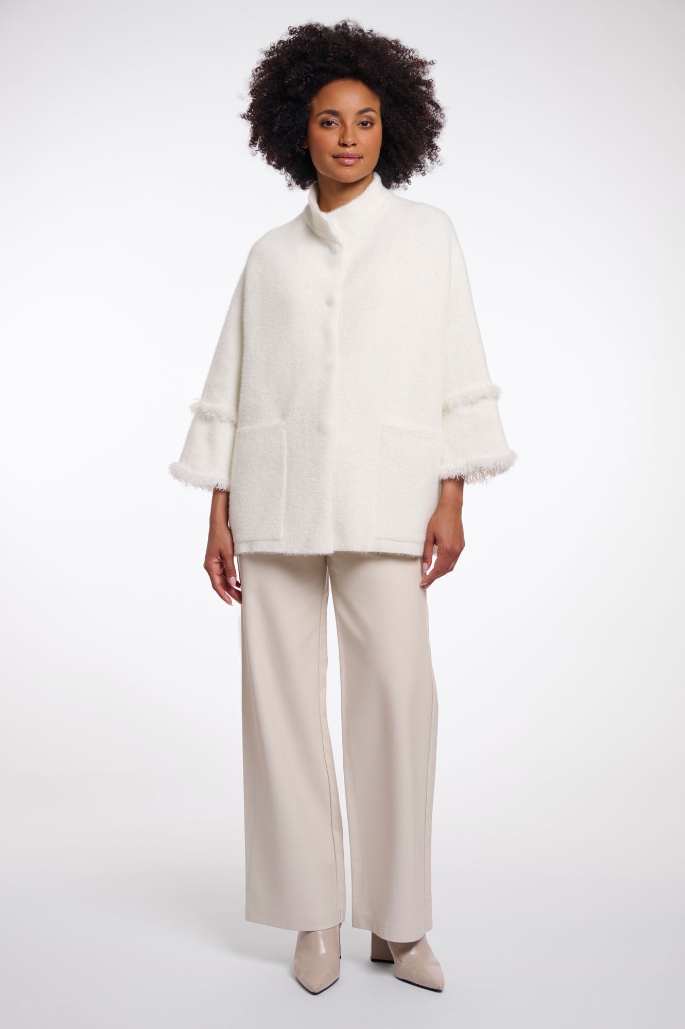 Cape with fringe details